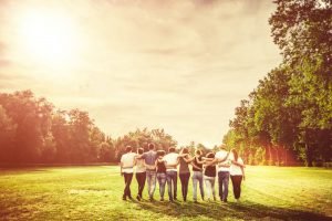 Rear,View,Of,Group,Of,Teenage,Friends,Walking,In,The