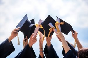 Graduation,Caps,Thrown,In,The,Air