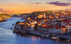 Antique,Town,Porto,,Portugal.,Sunset,Sun,Over,Silhouettes,Skyline,Of