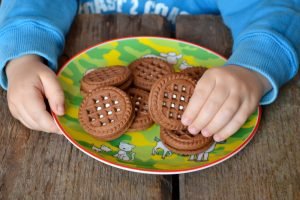 Chocolate,Chip,Cookies,In,The,Hands,Of,A,Child