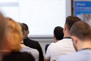 Back,View,Of,Audience,In,A,Business,Conference,Or,Seminar.