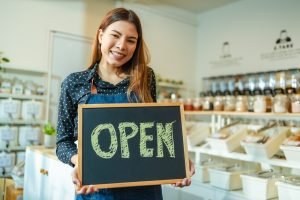 Young,Woman,Owner,In,Apron,Selling,Superfoods,In,Zero,Waste