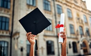 Cropped,Image,Of,Graduate,Holding,Academic,Hat,And,Diploma,With