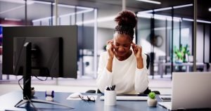 Focused,Black,Woman,With,Hand,Covering,Ear,,Trying,To,Hear